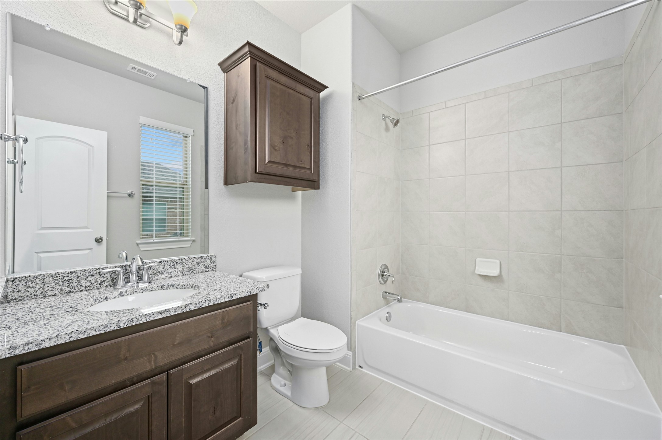 4124 Florentine Road Leander, TX 78641 - Photo 21 of 37 Full bathroom with toilet, tiled shower / bath, and vanity
