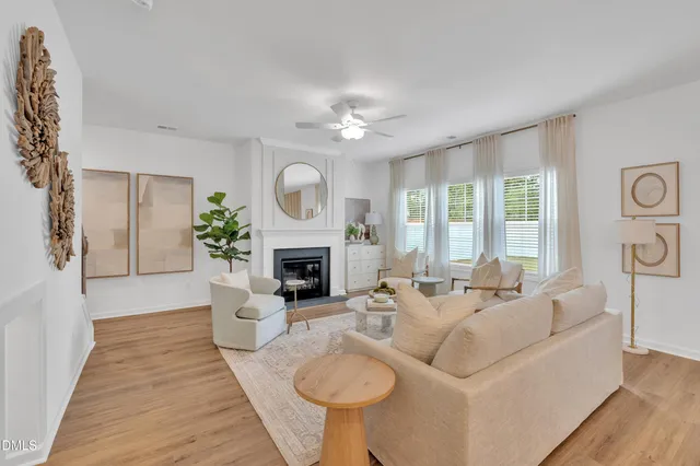 a bedroom with a bed chandelier and a window