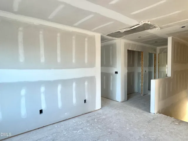 a view of a dining room with furniture and window