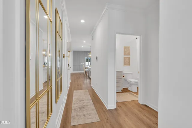 a bathroom with a toilet a sink and a mirror