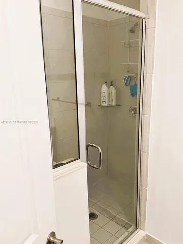 a bed room with a bed and a television