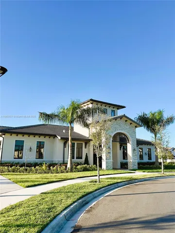 a view of multiple houses with a yard