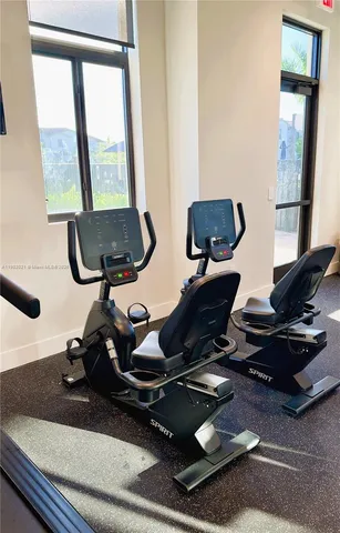 a living room with fireplace furniture and a flat screen tv