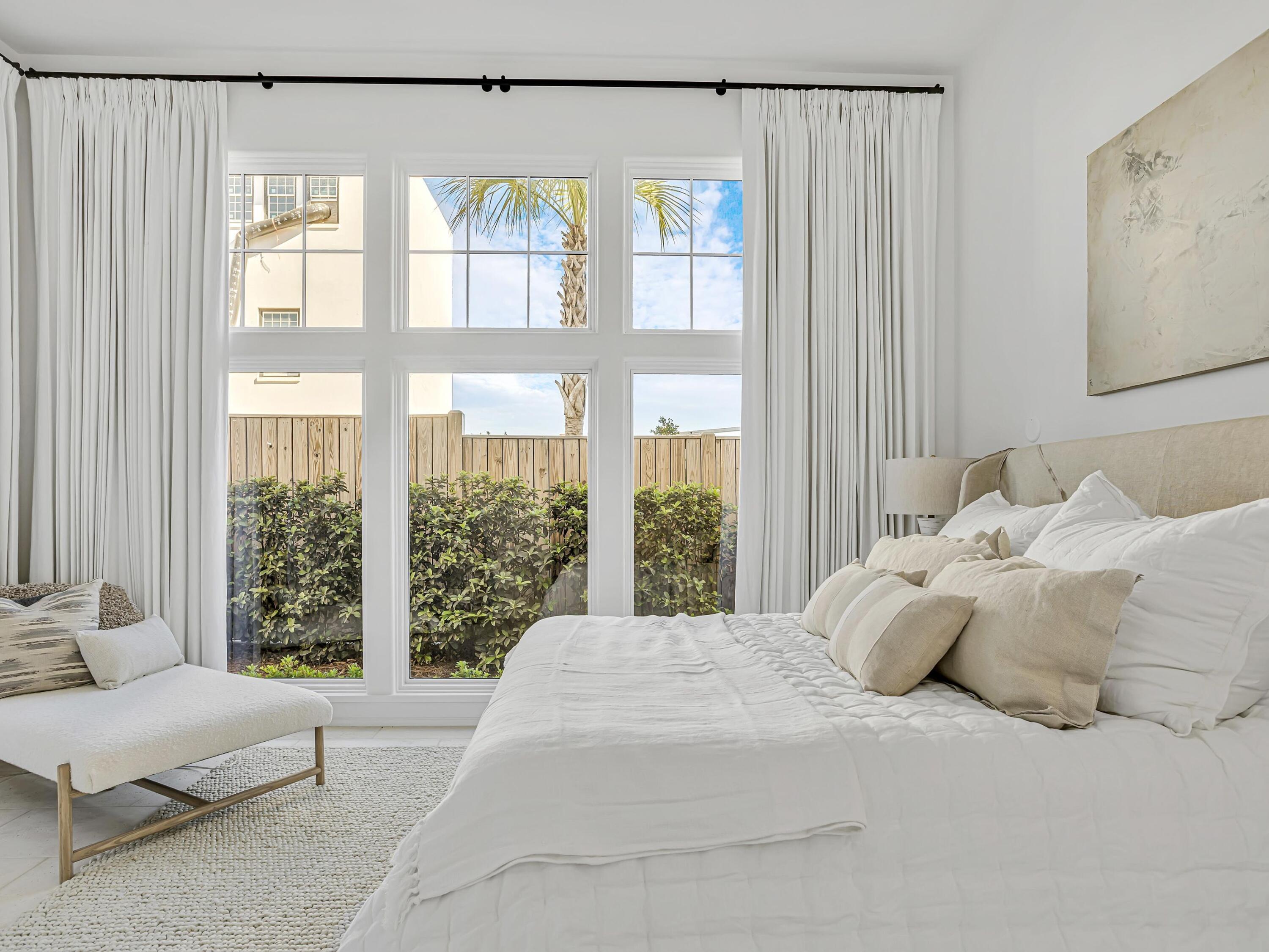 67 Kaiya Beach Ln Inlet Beach, Unit A Inlet Beach, FL 32461 - Photo 11 of 27 a large white bed sitting in a bedroom next to a large window