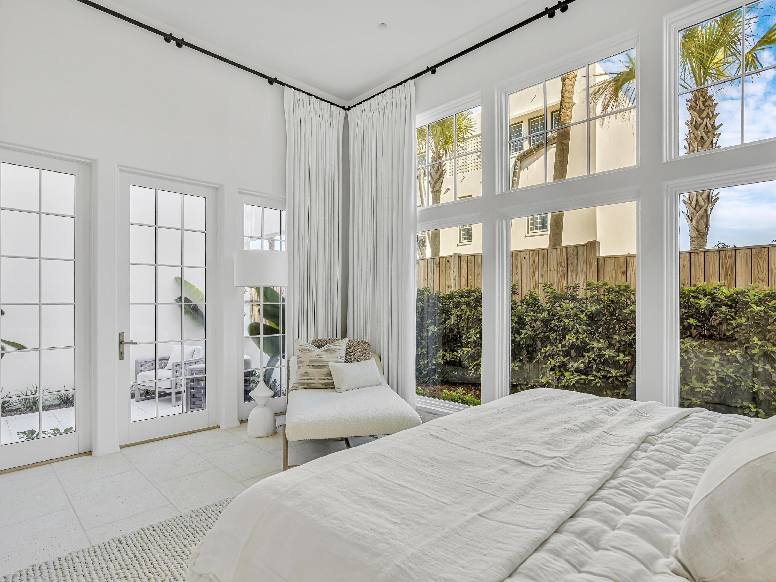 67 Kaiya Beach Ln Inlet Beach, Unit A Inlet Beach, FL 32461 - Photo 12 of 27 a bedroom with a large bed and a large window