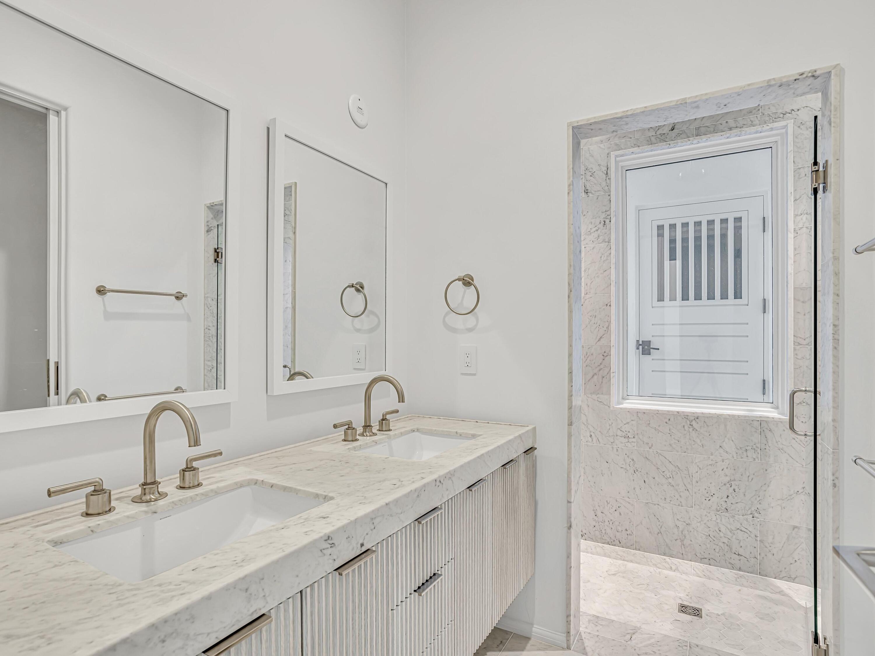 67 Kaiya Beach Ln Inlet Beach, Unit A Inlet Beach, FL 32461 - Photo 13 of 27 a bathroom with double sink shower and a mirror