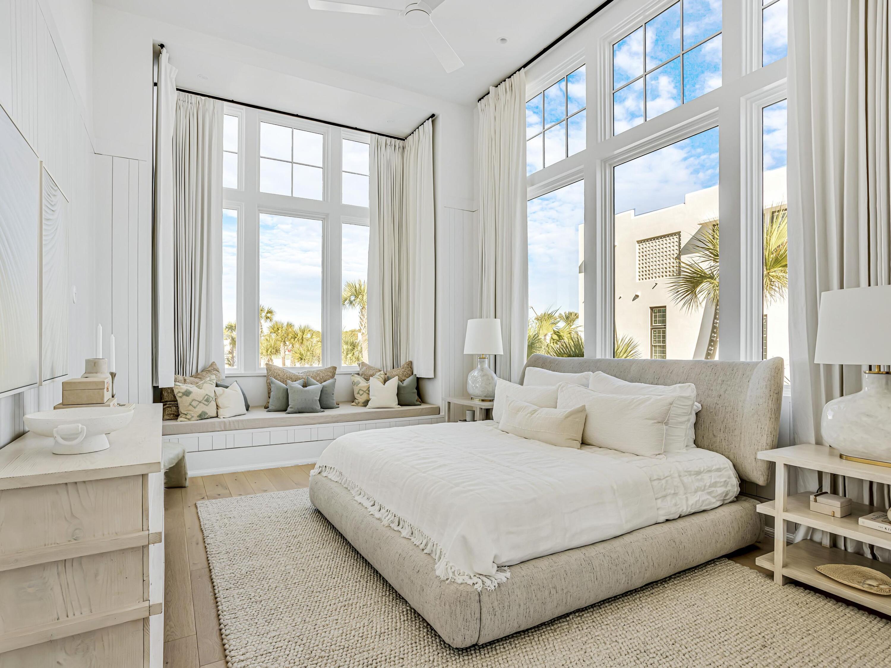 67 Kaiya Beach Ln Inlet Beach, Unit A Inlet Beach, FL 32461 - Photo 16 of 27 a bedroom with a large bed and a large window