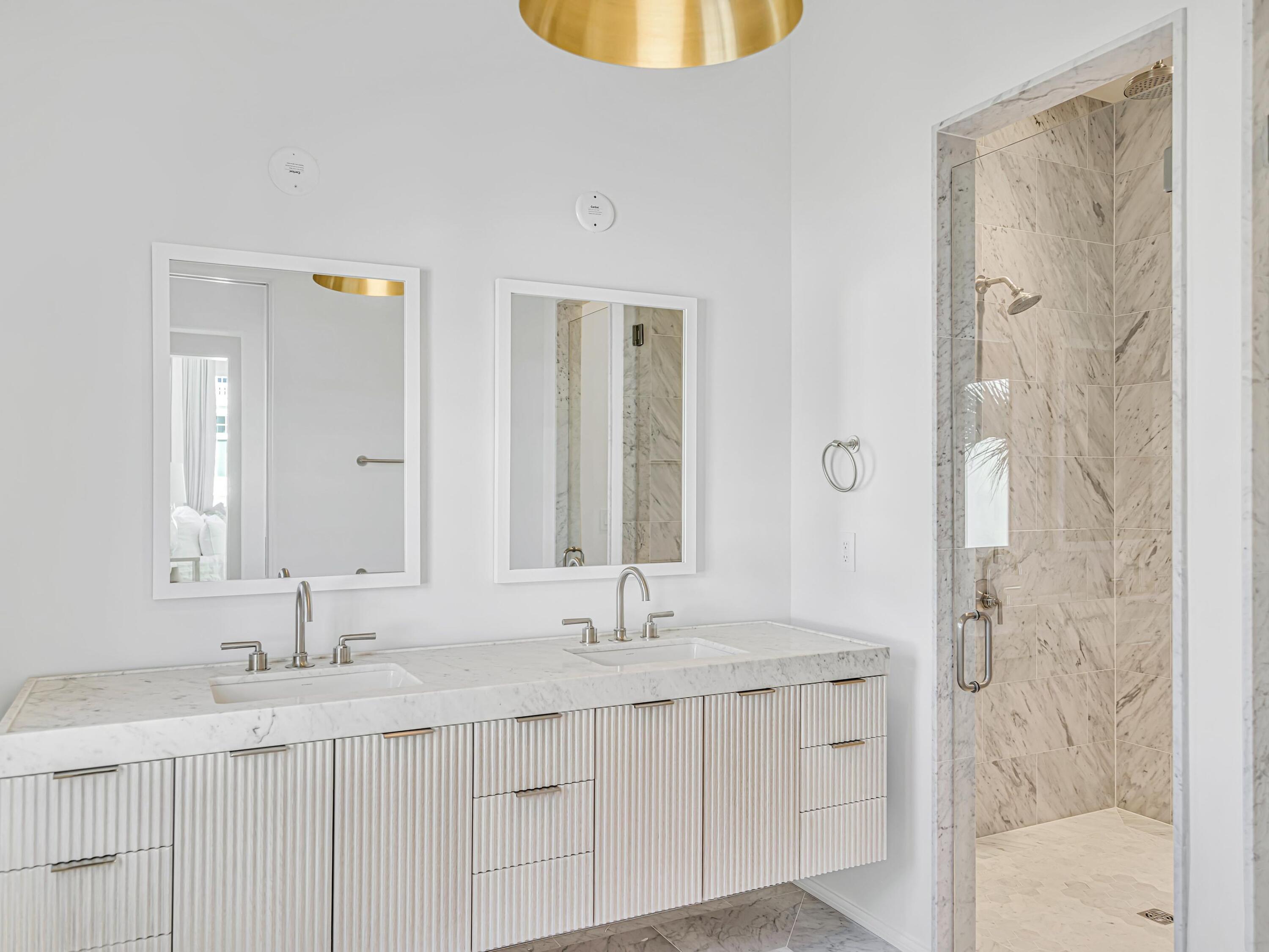 67 Kaiya Beach Ln Inlet Beach, Unit A Inlet Beach, FL 32461 - Photo 18 of 27 a bathroom with a granite countertop sink and a mirror