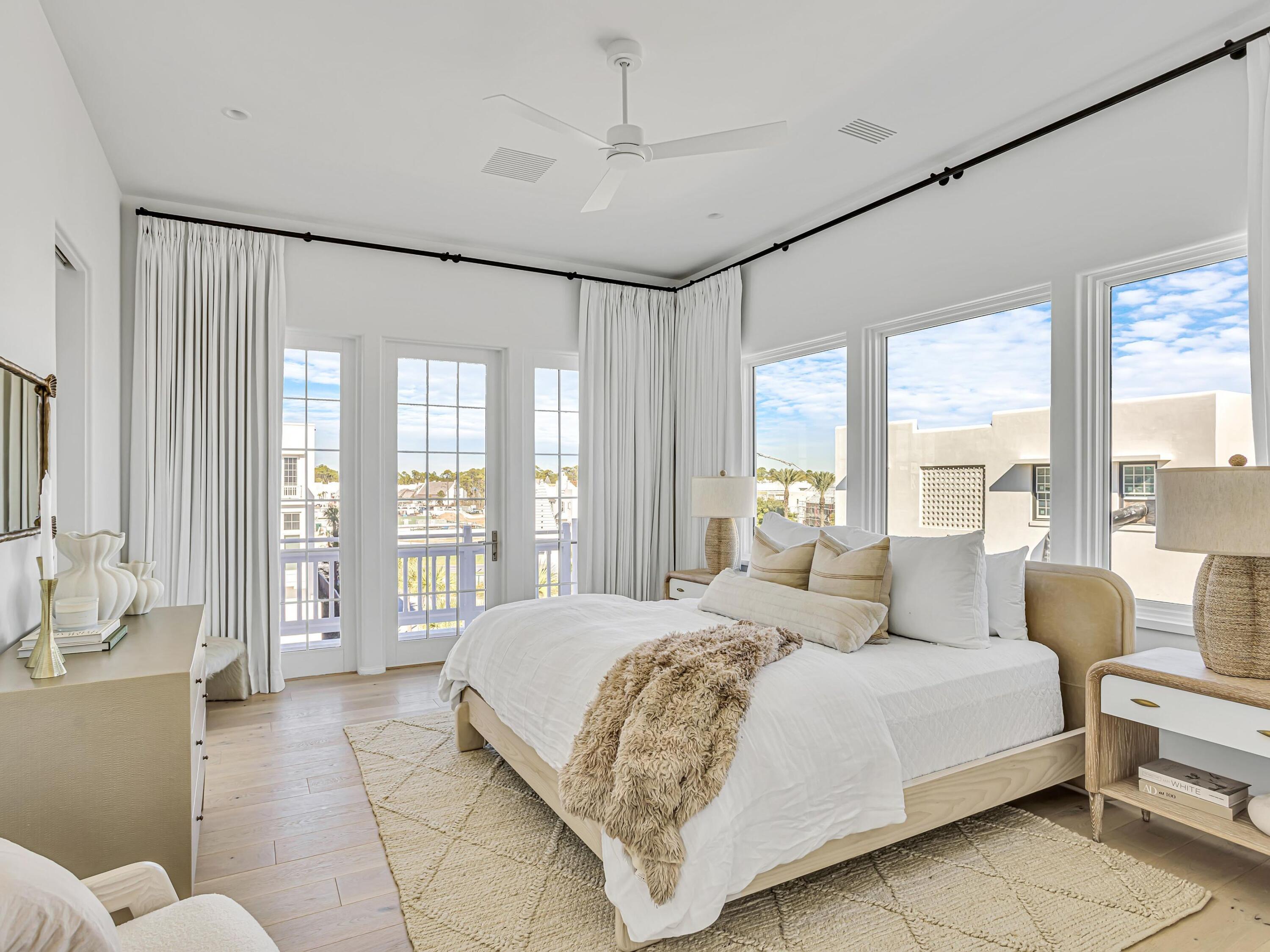 67 Kaiya Beach Ln Inlet Beach, Unit A Inlet Beach, FL 32461 - Photo 19 of 27 a spacious bedroom with a large bed and a large window