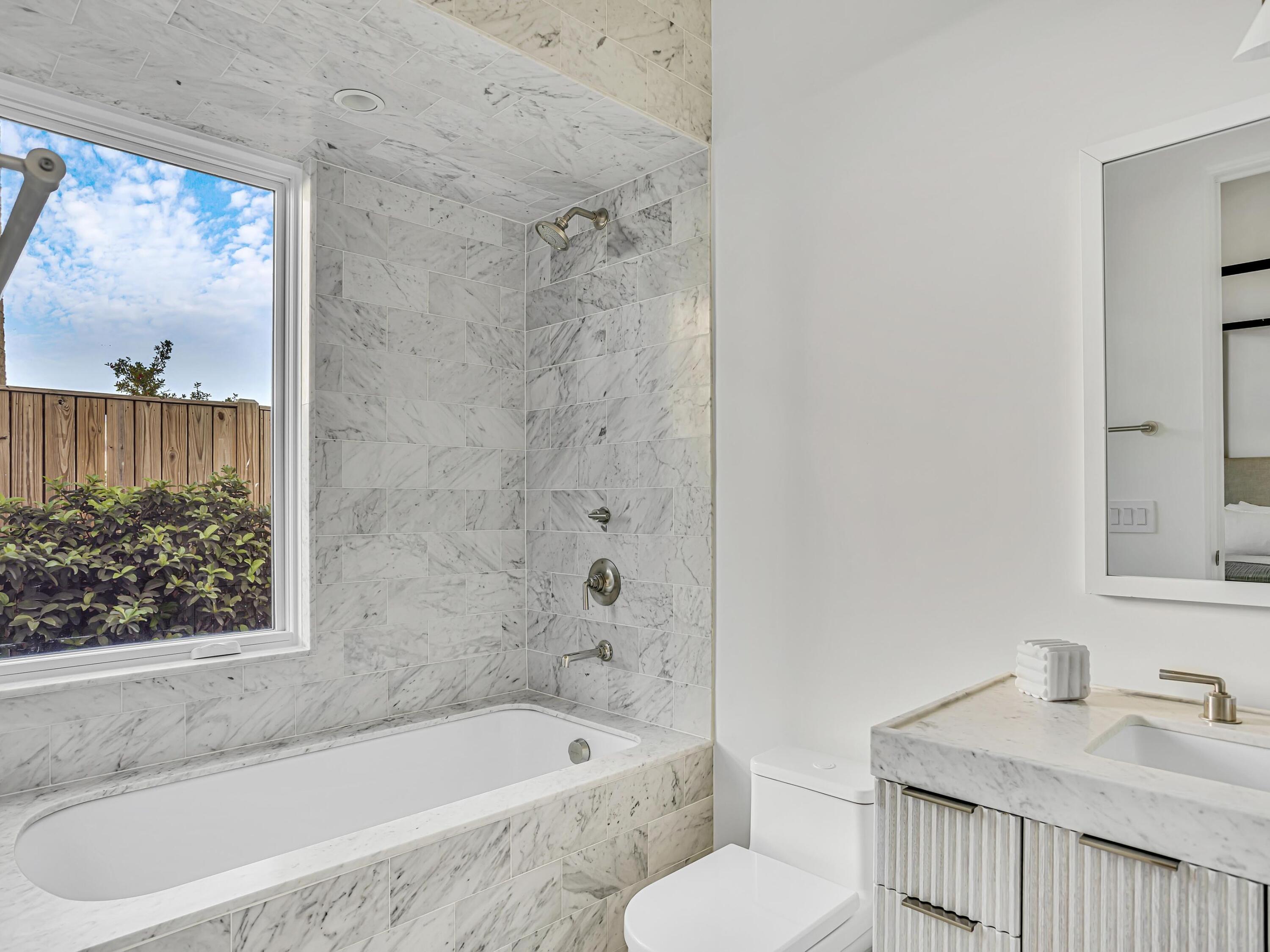 67 Kaiya Beach Ln Inlet Beach, Unit A Inlet Beach, FL 32461 - Photo 10 of 27 a bathroom with a sink a toilet and bathtub