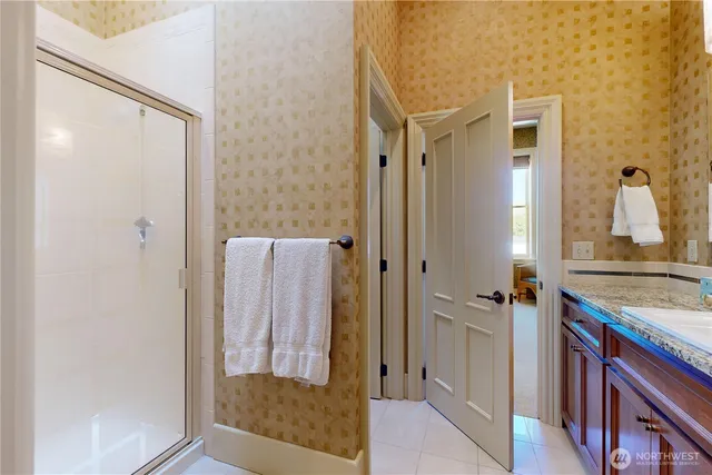 a bathroom with a shower and a sink