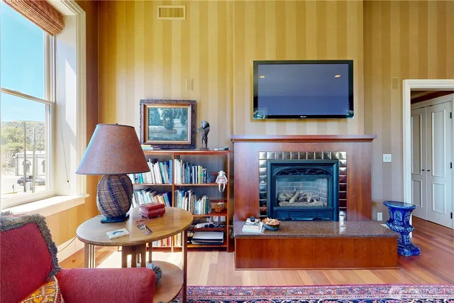 a living room with furniture and a fireplace