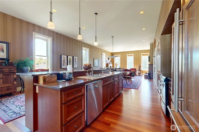 a kitchen with lots of counter space and windows