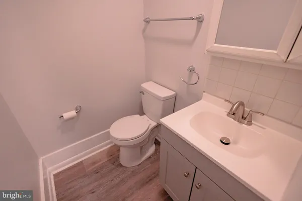 a bathroom with a sink and toilet