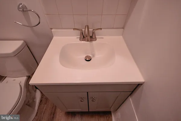 a utility room with a stove and a mirror