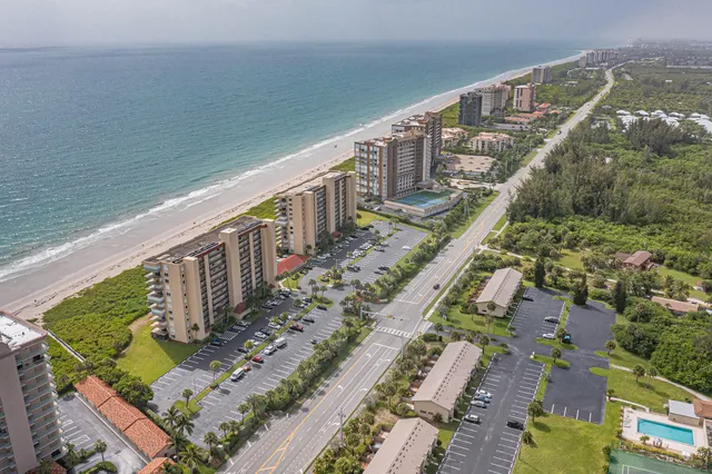a view of a balcony with wooden floor and fence