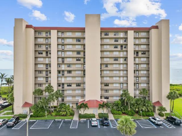 a view of a building with potted plants