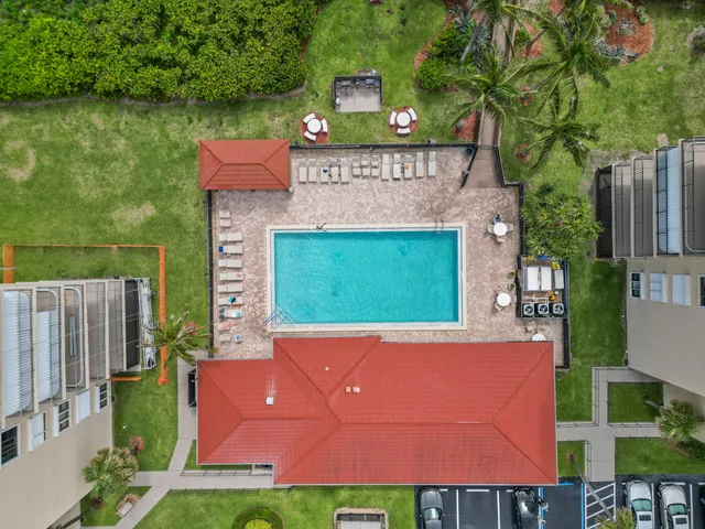 a view of a swimming pool with a garden