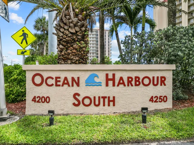 a kitchen with a sink window and cabinets