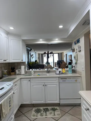 a bathroom with a shower sink vanity and toilet