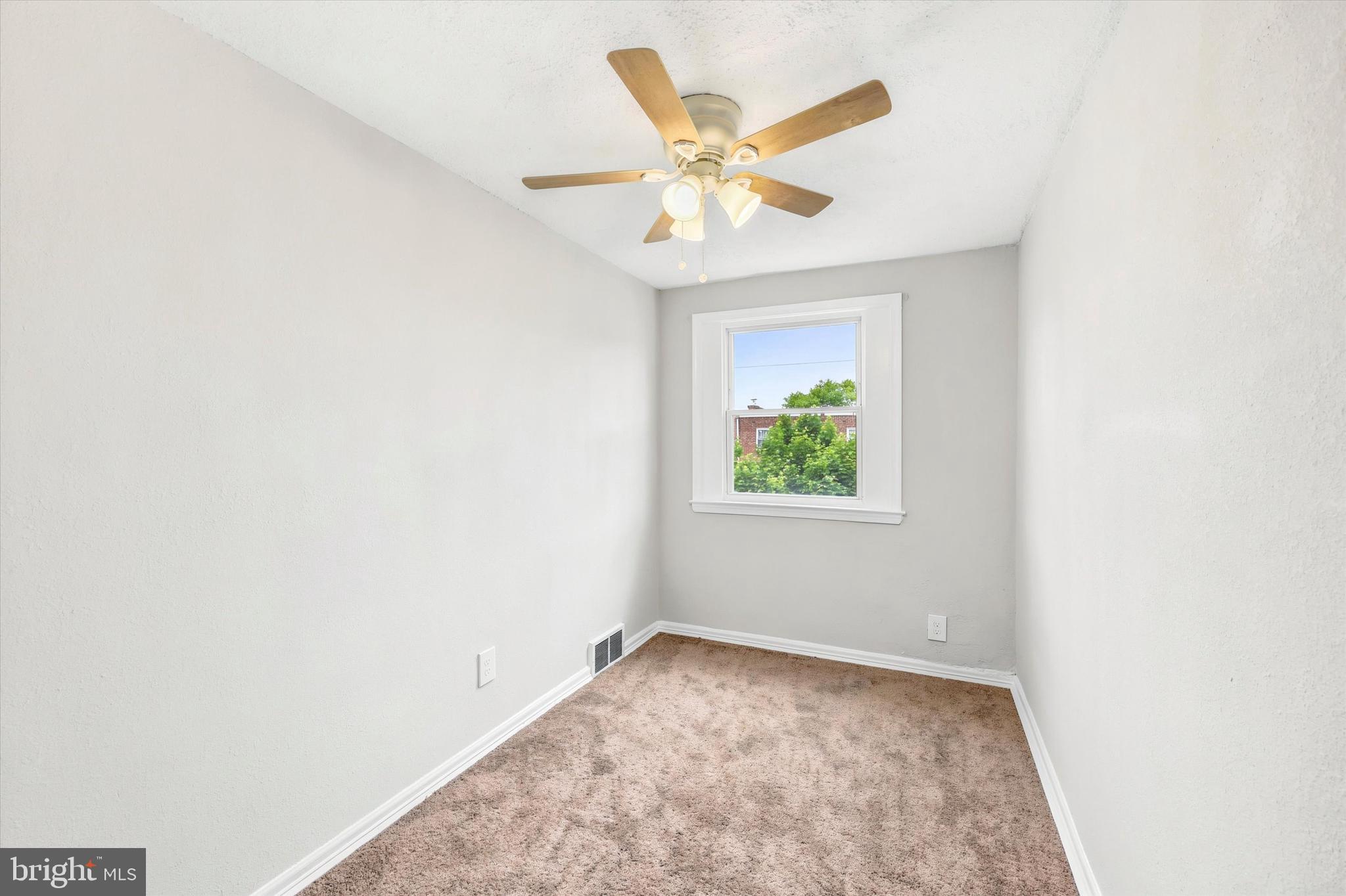 2052 Heather Road Folcroft, PA 19032 - Photo 11 of 17 an empty room with a window and a ceiling fan