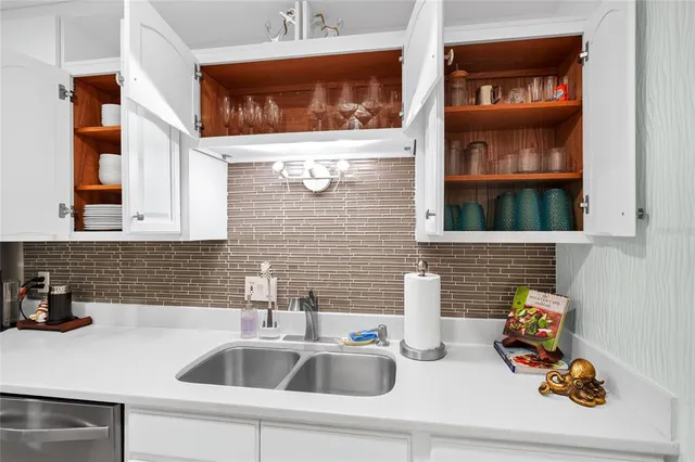 a bathroom with a sink and a window