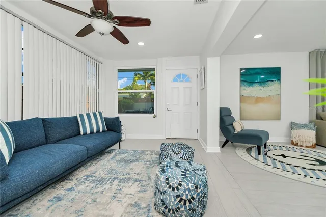 a living room with furniture and a large window
