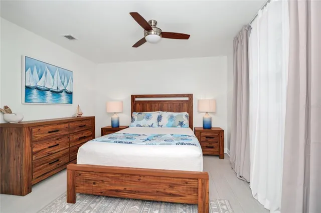 a bedroom with a bed and a dresser