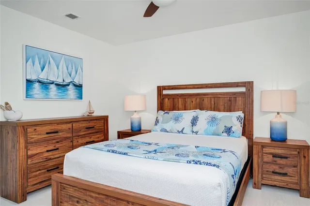 a bedroom with a bed and a dresser