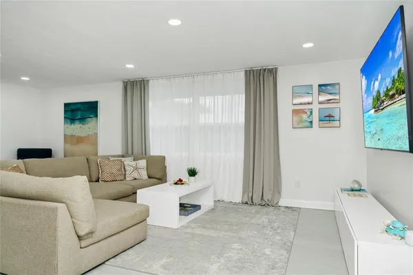 a living room with furniture and a window