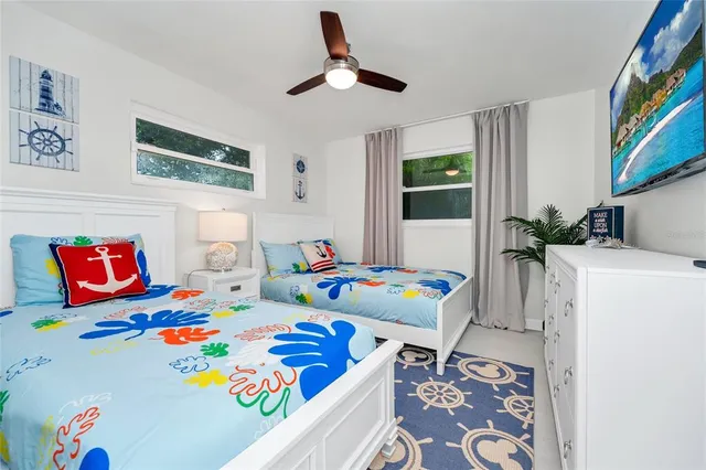 a bedroom that has a bed and a table in it