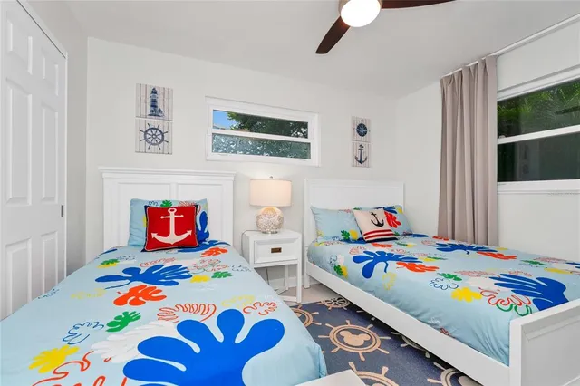 a room that has a bed and a painting on the wall