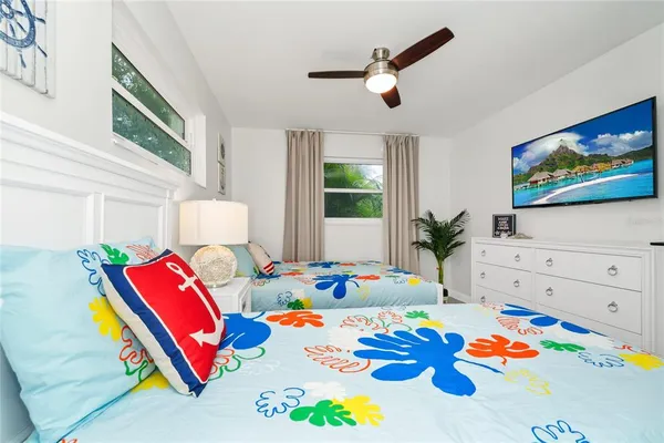 a bedroom with a bed and a dresser