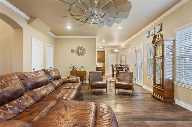 a living room with furniture or couch and a chandelier