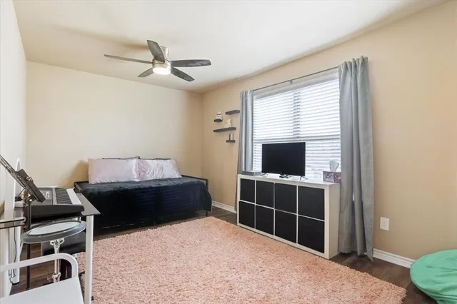 a bed room with a bed and a television