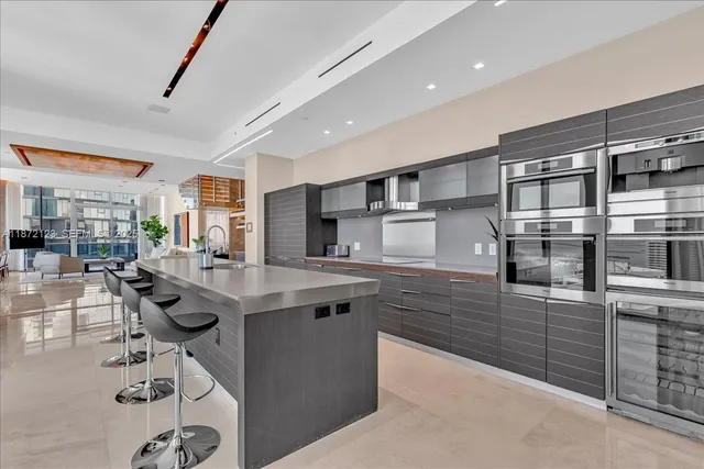 a kitchen with a table and chairs in it