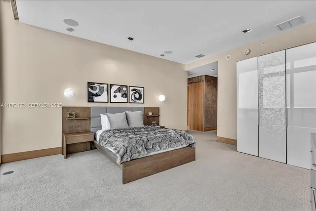a bathroom with a bathtub and a large mirror