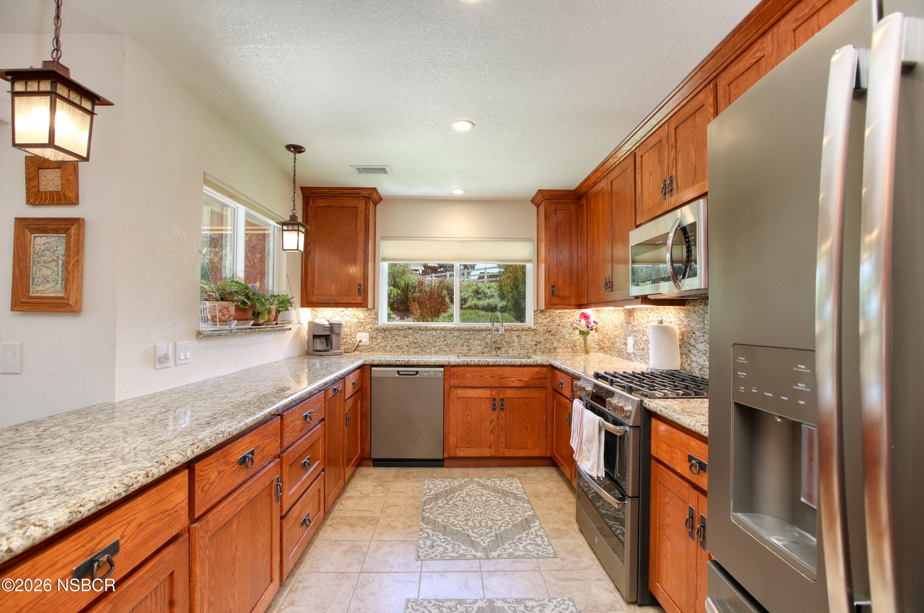 435-433 Eucalyptus Road, Unit 435433 Nipomo, CA 93444 - Photo 3 of 78 a large kitchen with stainless steel appliances granite countertop a lot of counter space and a sink