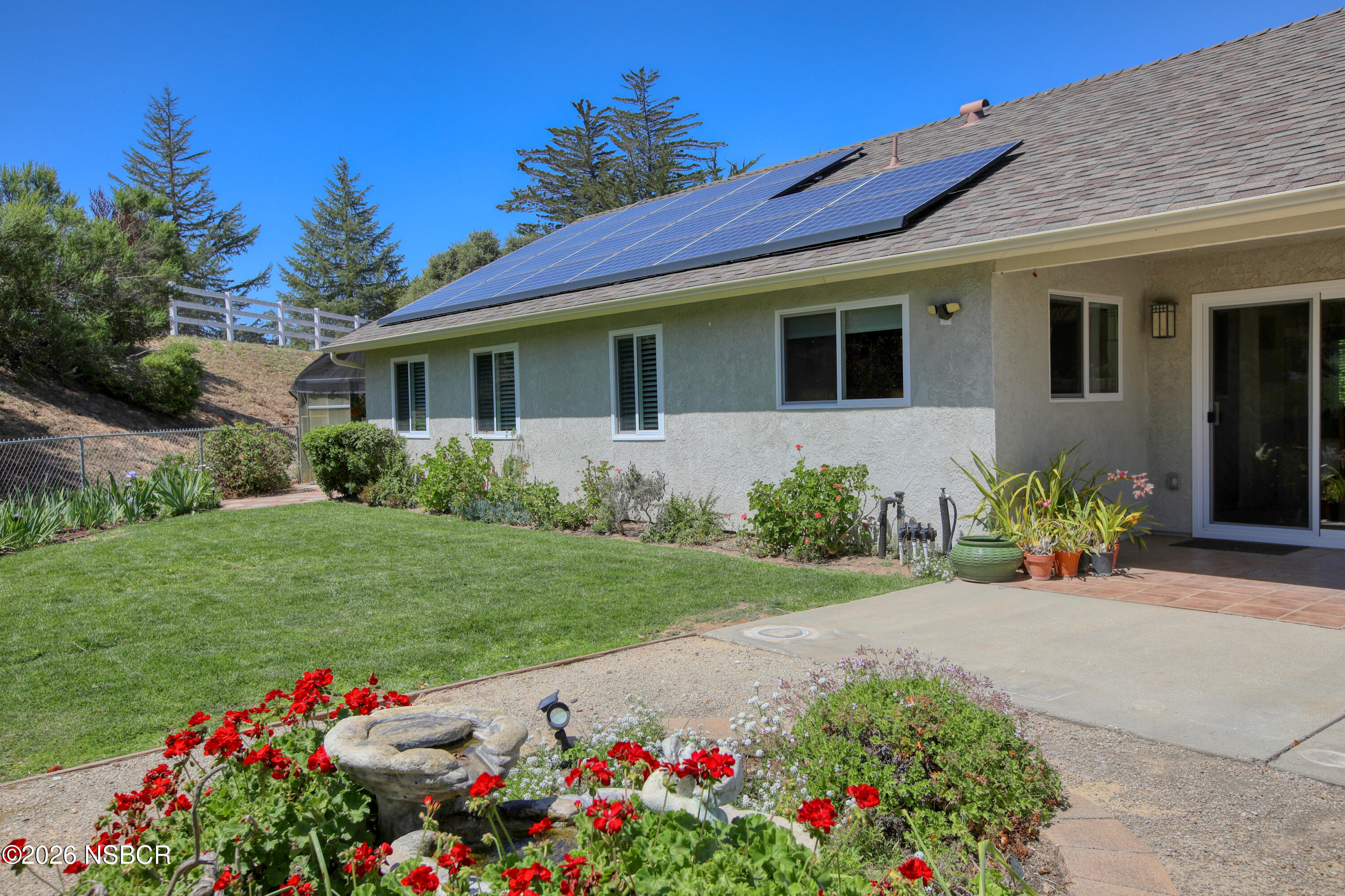 435-433 Eucalyptus Road, Unit 435433 Nipomo, CA 93444 - Photo 41 of 78 a front view of a house with a yard