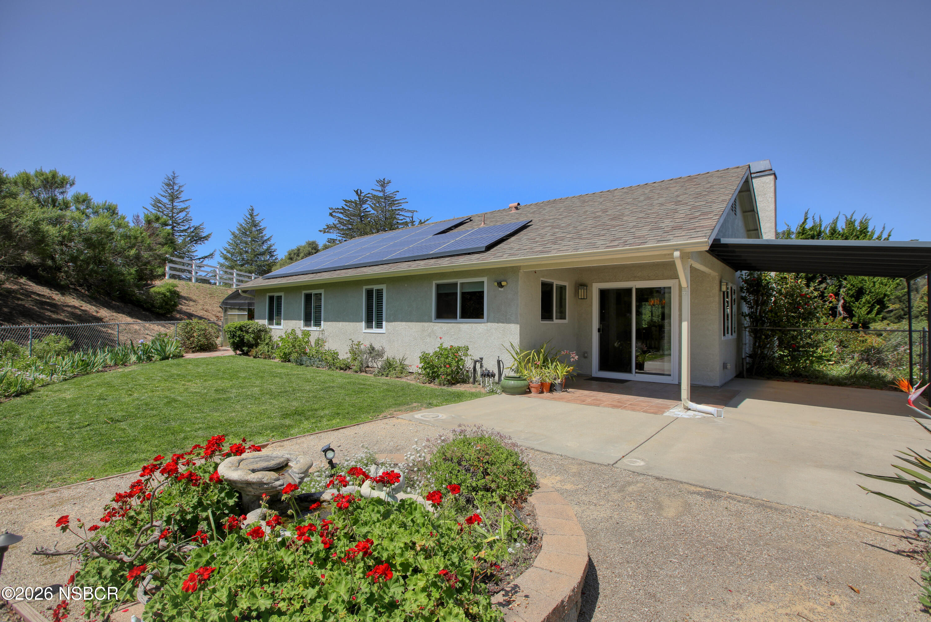 435-433 Eucalyptus Road, Unit 435433 Nipomo, CA 93444 - Photo 43 of 78 a front view of a house with a garden