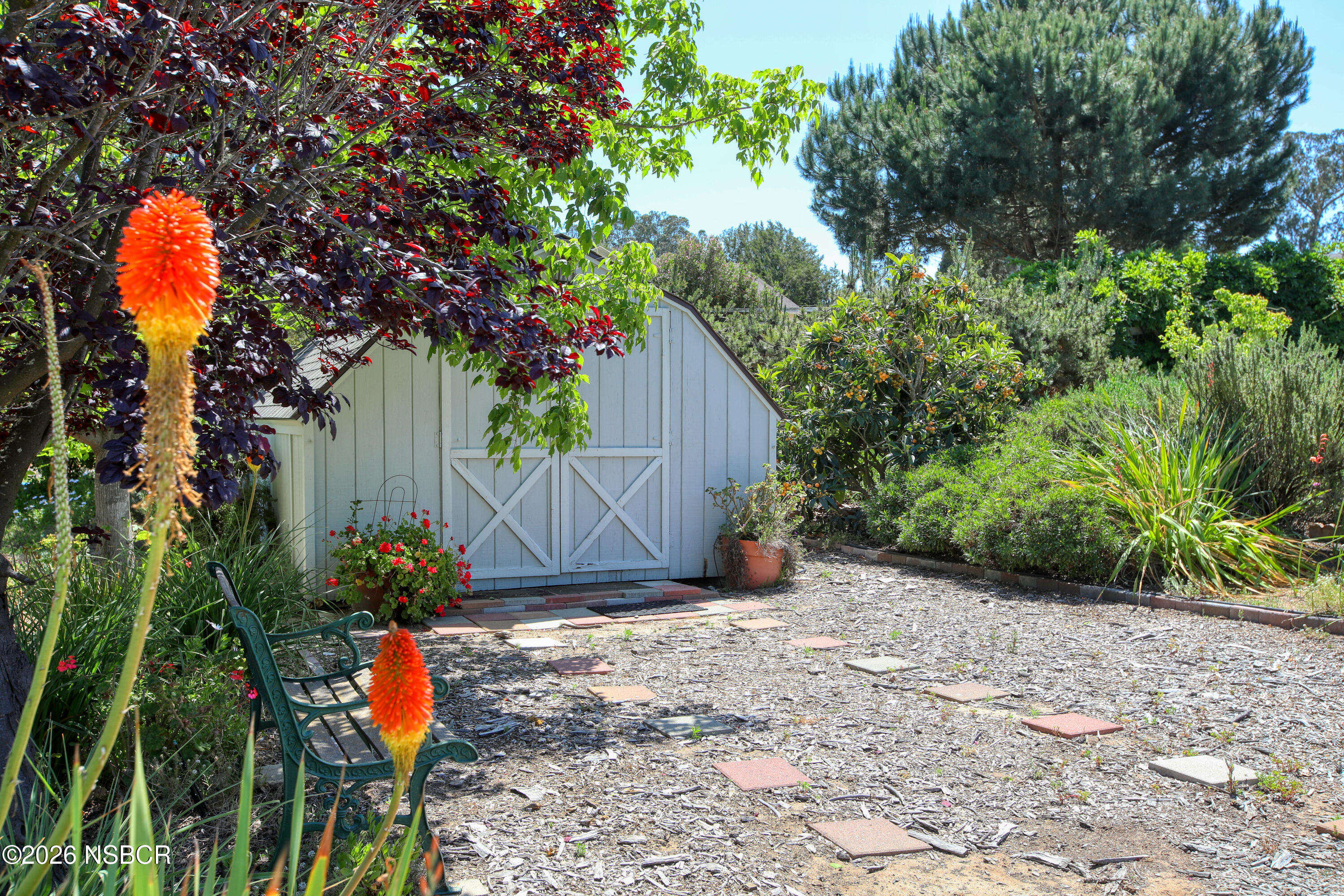 435-433 Eucalyptus Road, Unit 435433 Nipomo, CA 93444 - Photo 55 of 78 a backyard of a house with lots of green space and plants