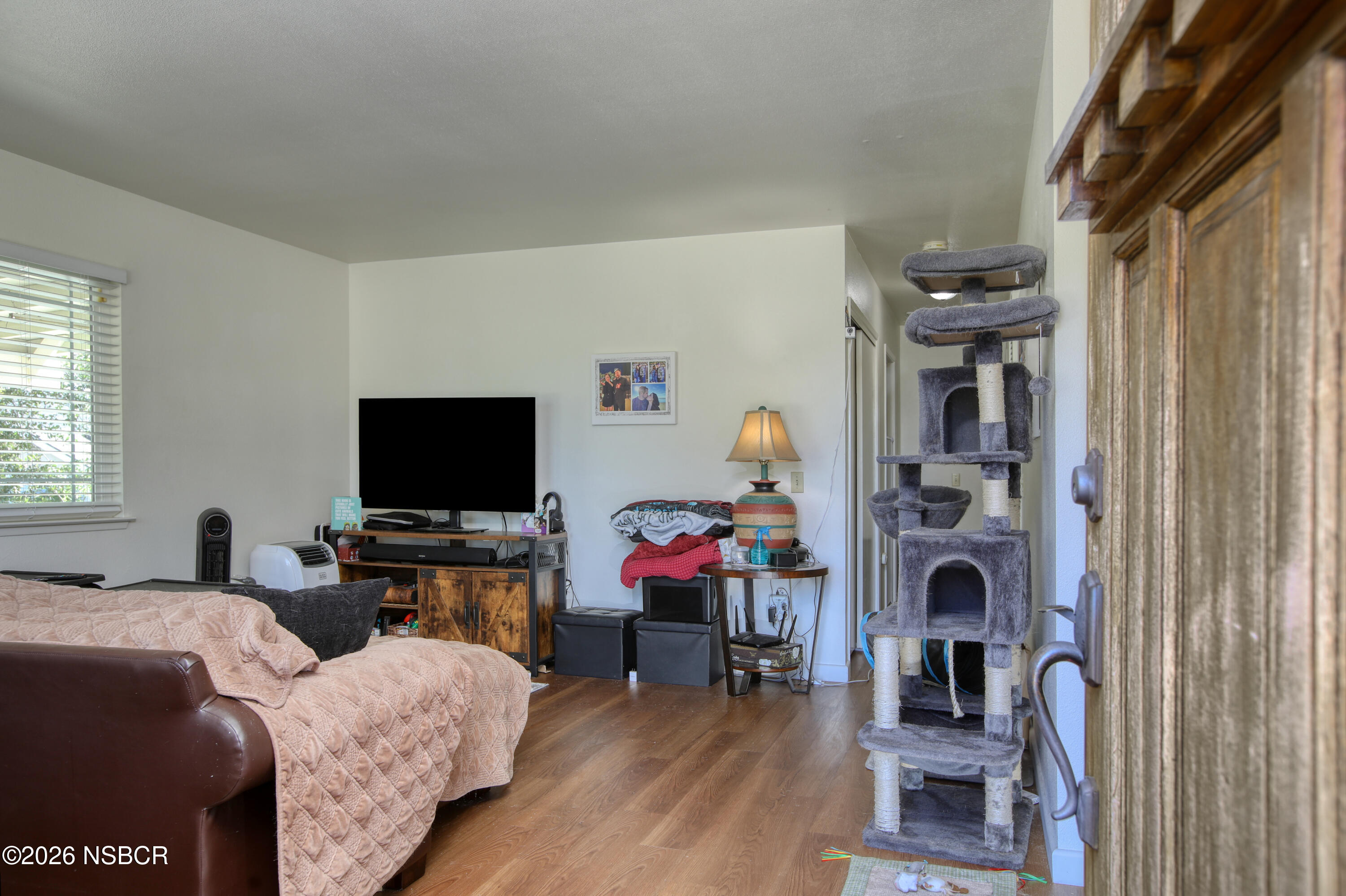 435-433 Eucalyptus Road, Unit 435433 Nipomo, CA 93444 - Photo 65 of 78 a living room with furniture and a flat screen tv
