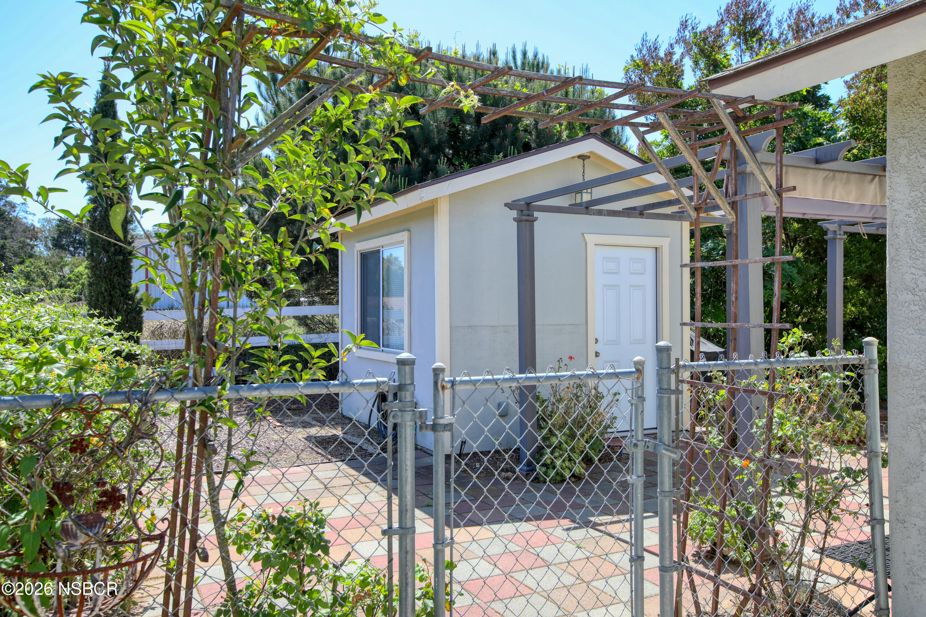 435-433 Eucalyptus Road, Unit 435433 Nipomo, CA 93444 - Photo 66 of 78 433 Side View of Outhouse & Gate
