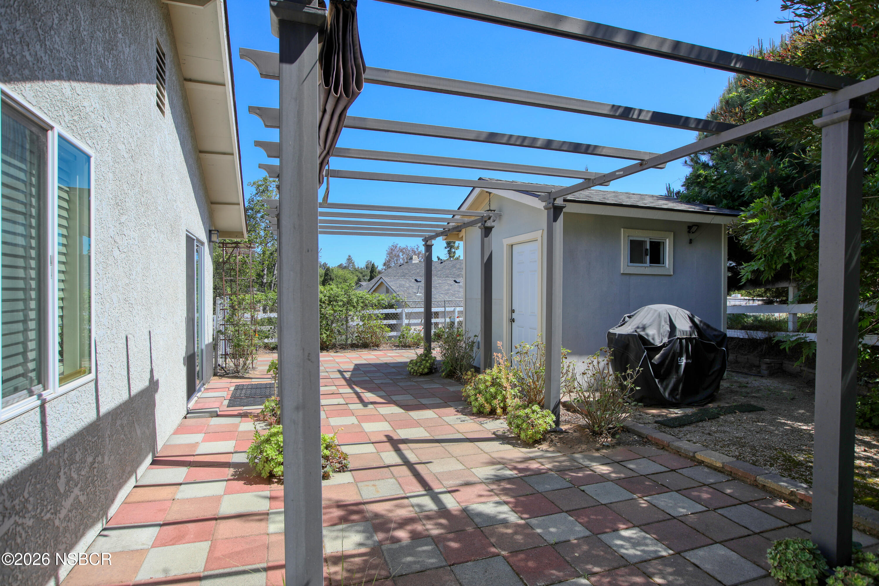 435-433 Eucalyptus Road, Unit 435433 Nipomo, CA 93444 - Photo 68 of 78 a front view of a house with garden