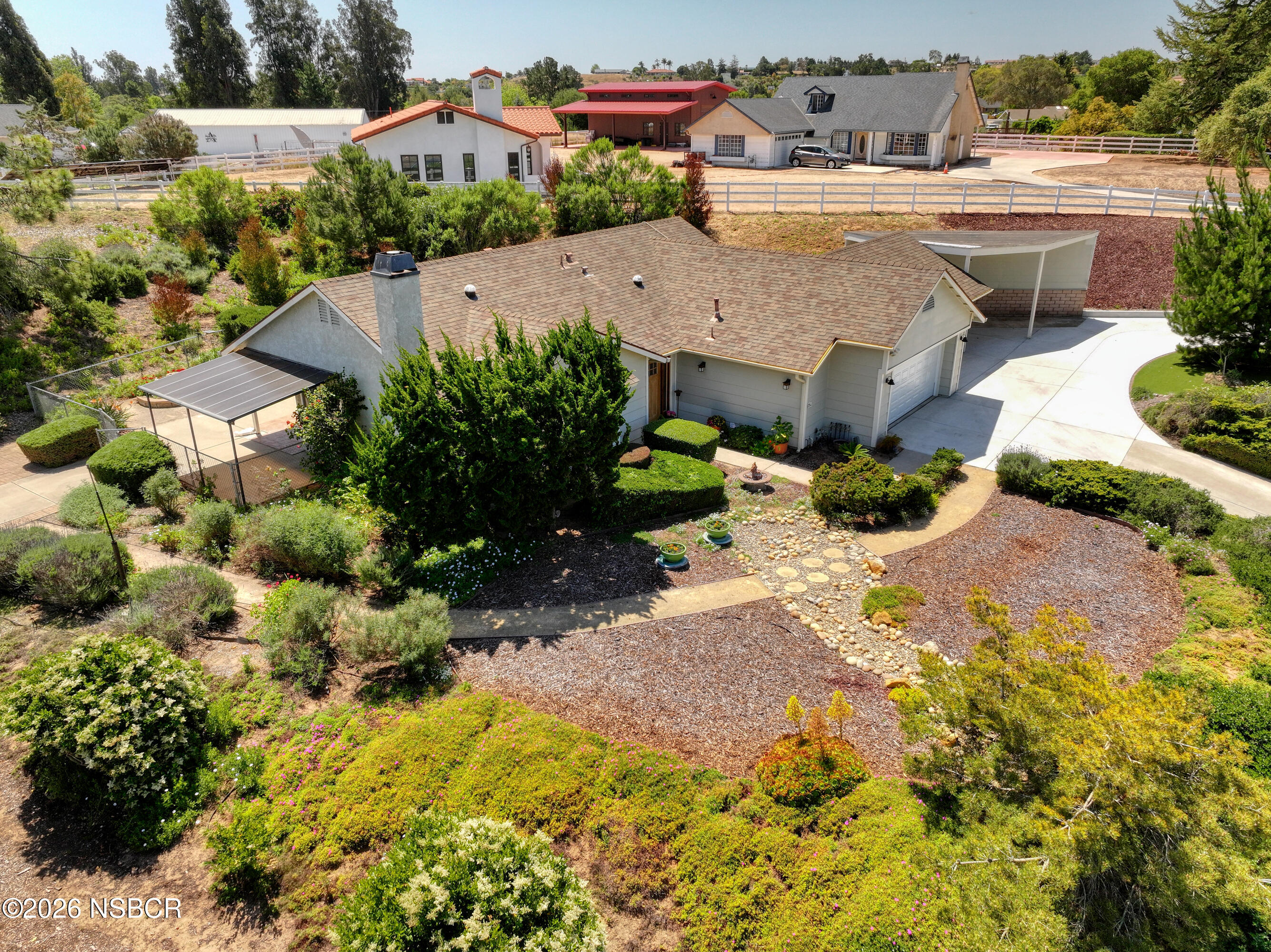 435-433 Eucalyptus Road, Unit 435433 Nipomo, CA 93444 - Photo 70 of 78 an aerial view of a house with a yard and plants