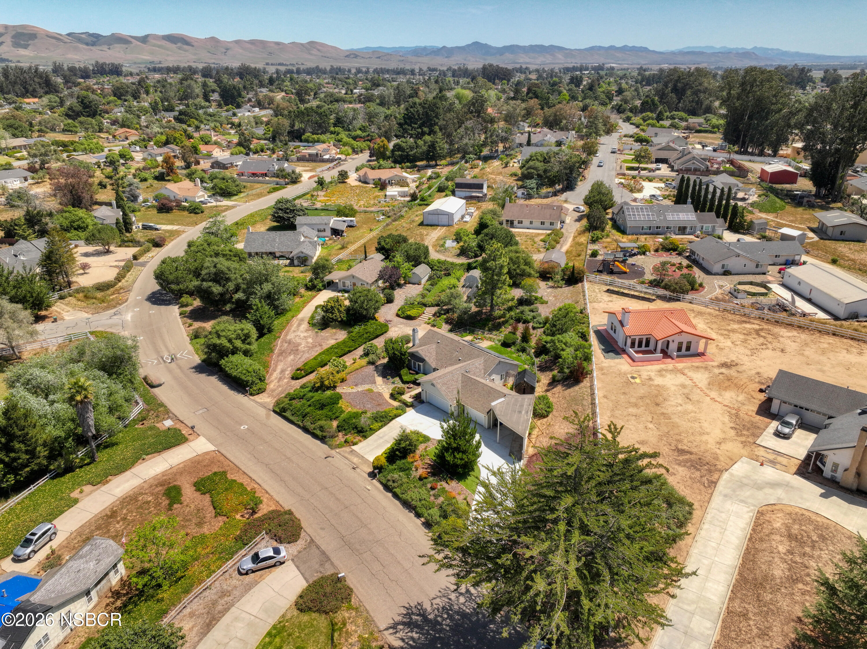 435-433 Eucalyptus Road, Unit 435433 Nipomo, CA 93444 - Photo 74 of 78 an aerial view of residential houses with outdoor space