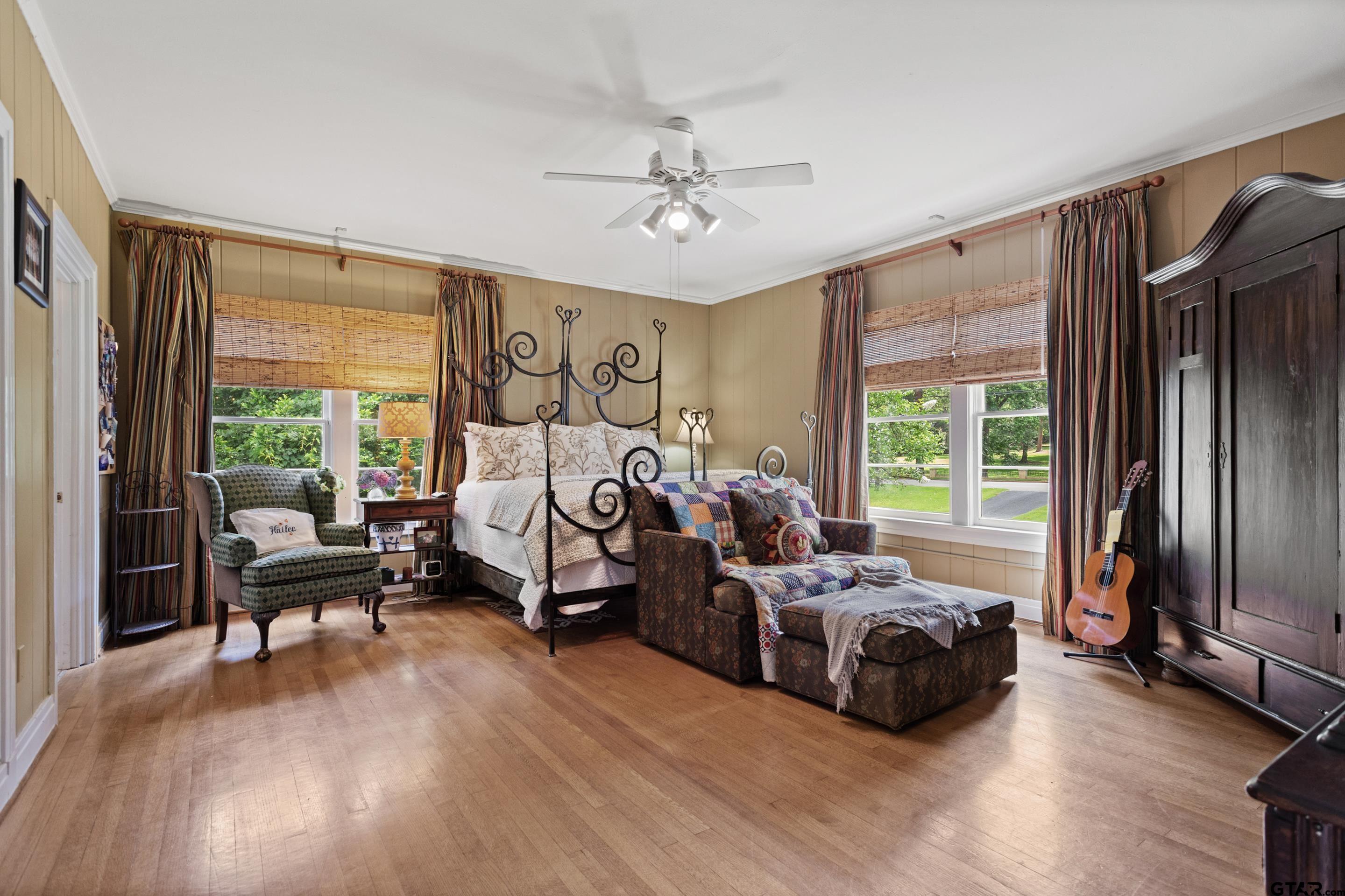 2631 Old Bullard Road Tyler, TX 75701 - Photo 35 of 43 a bedroom with furniture and a large window