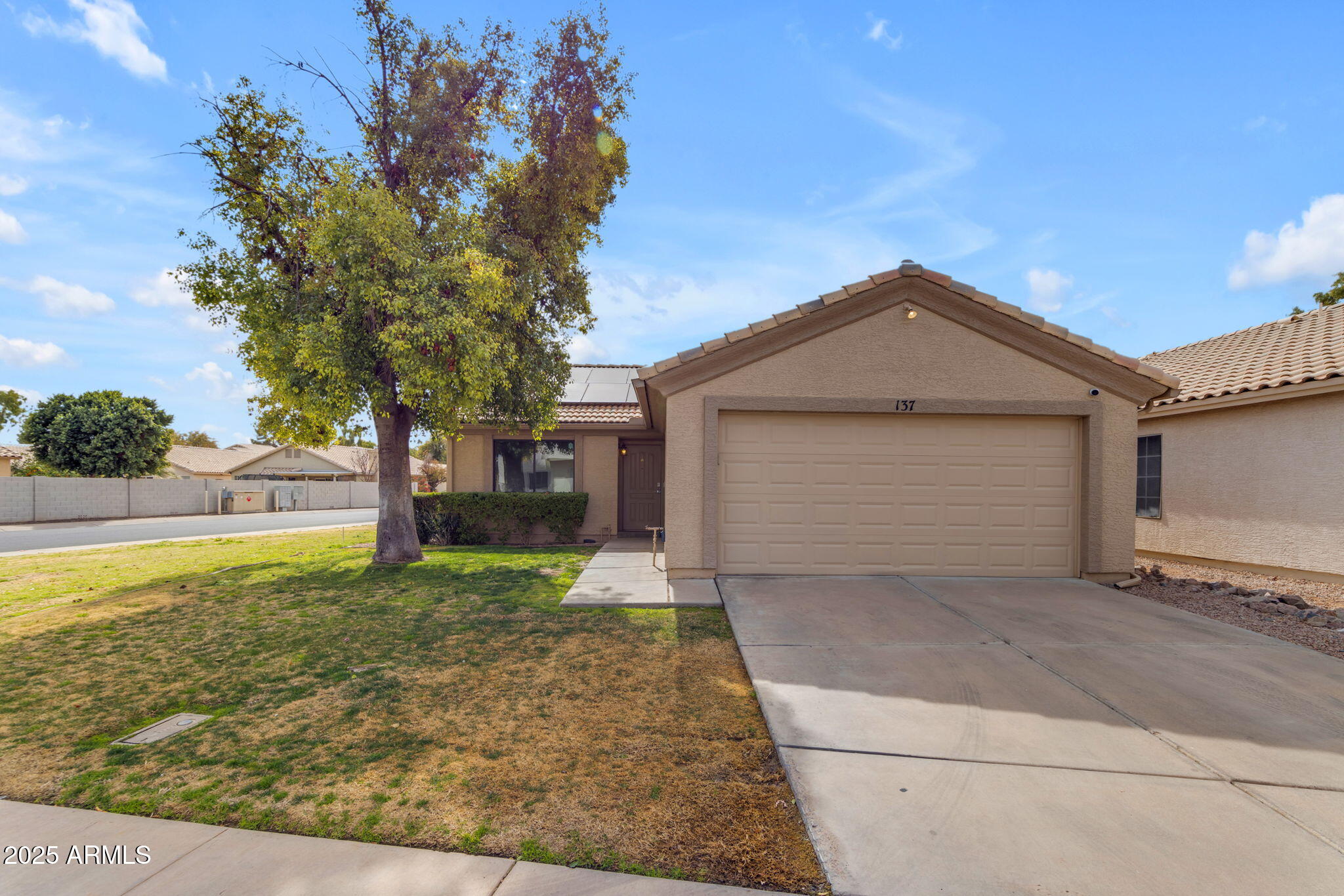 137 West Gary Way Gilbert, AZ 85233 - Photo 2 of 43 a front view of a house with garden