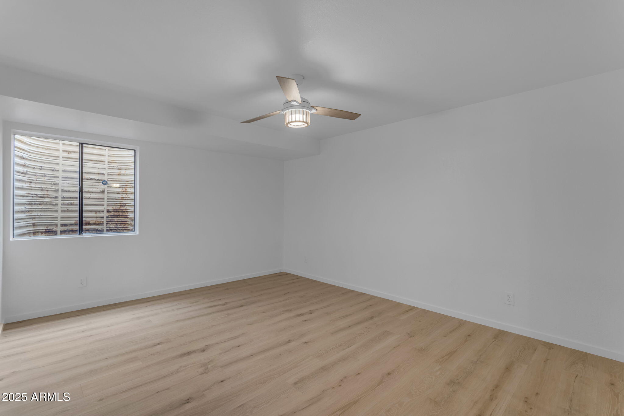 137 West Gary Way Gilbert, AZ 85233 - Photo 37 of 43 wooden floor in an empty room with a window
