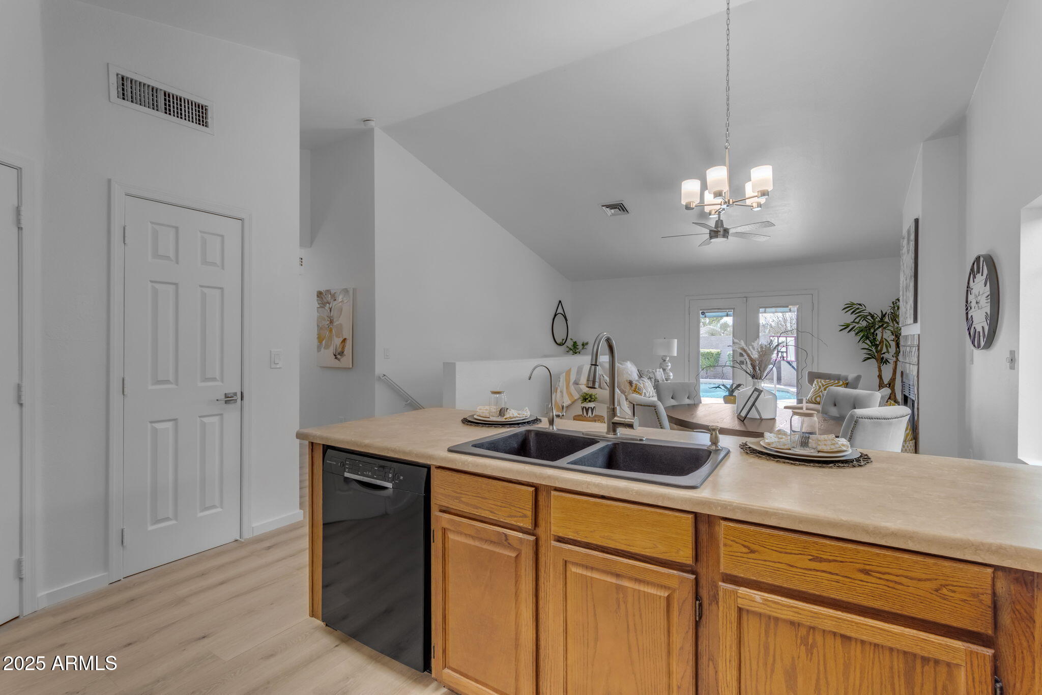 137 West Gary Way Gilbert, AZ 85233 - Photo 5 of 43 a kitchen with a sink and chandelier